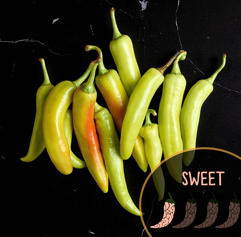 Green and orange Banana sweet peppers on a black background with 'SWEET' text.